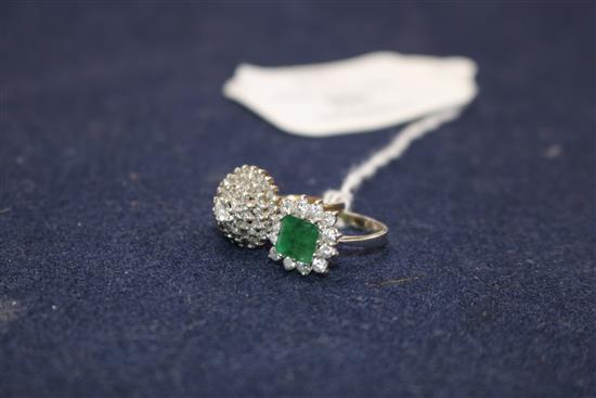 An 18ct white gold, emerald and diamond cluster ring and a 9ct gold and diamond cluster ring.